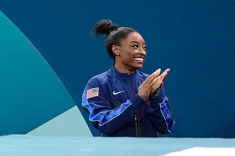 Simone Biles celebrates after winning the silver medal